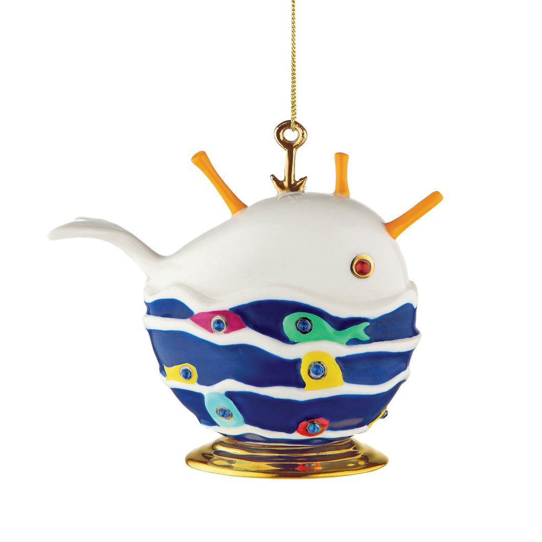 Alessi home ornament in porcelain, hand decorated as a whale with a school of fish.
