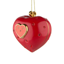 Alessi home ornament in porcelain, hand decorated as a red heart, embellished with a face. Has two halves.
