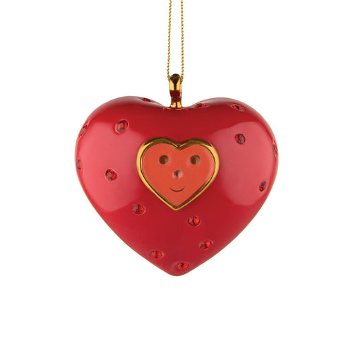 Alessi home ornament in porcelain, hand decorated as a red heart, embellished with a face. Has two halves.
