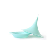 A uniquely designed silicone storage vessel with a tall pointed lid, mint. 