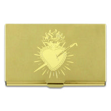 Heart design by Frida Kahlo on a brass colored mirror chrome finished metal card case.