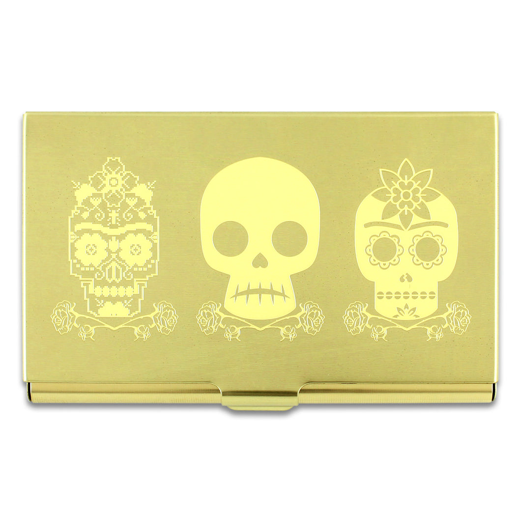 Skulls design by Frida Kahlo on a brass colored mirror chrome finished metal card case.