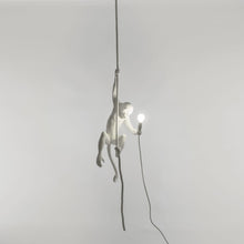 Seletti hanging from the ceiling monkey light, approx 31", made of resin.