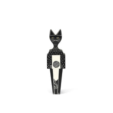 The small cat doll is made out of solid fir and is hand painted to a black finish. Made out of 3 separate pieces combined to make a doll. 