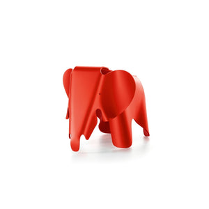 Red plastic elephant designed by Charles and Ray Eames.