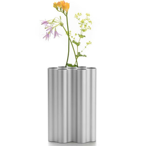 Silver anodized aluminum vase with various openings for a stylish arrangement.